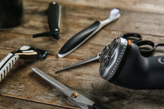 Set,of,male,shaving,accessories,on,wooden,background